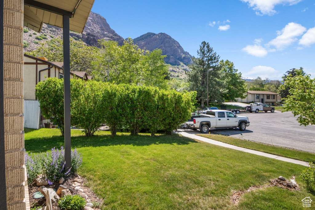 View of green lawn with a mountain view