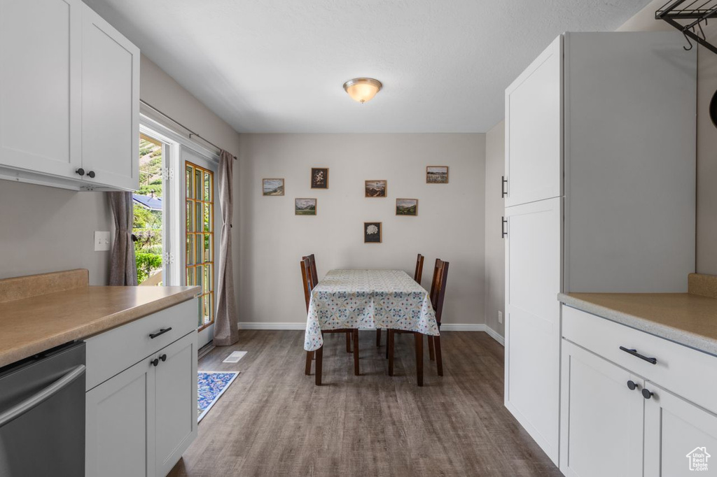 Dining room with wood finished floors and baseboards
