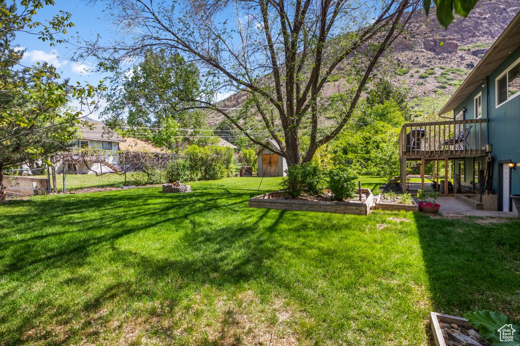 View of yard featuring a wooden deck