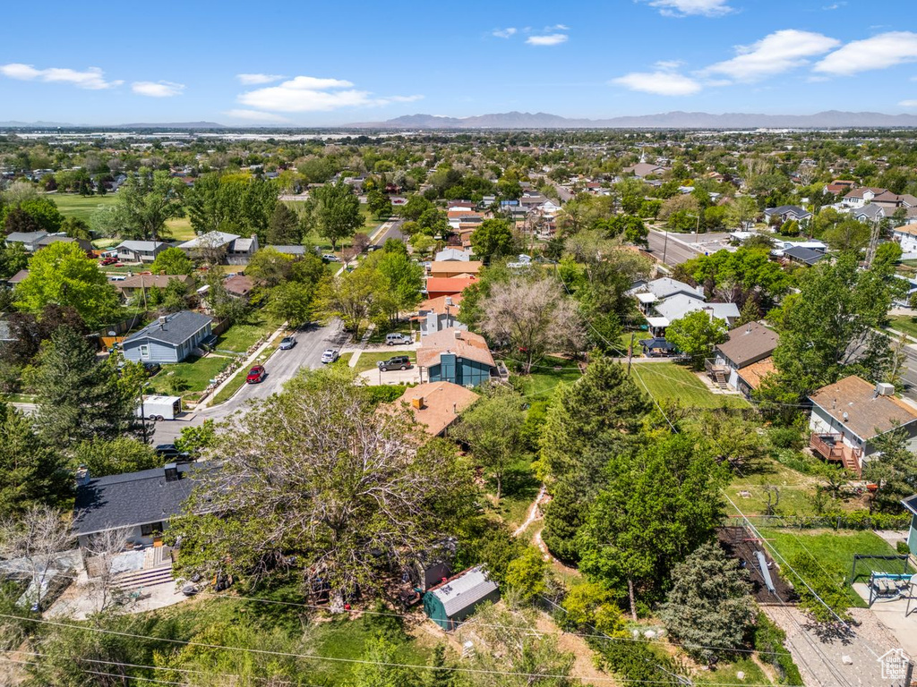 Aerial perspective of suburban area featuring a mountain backdrop