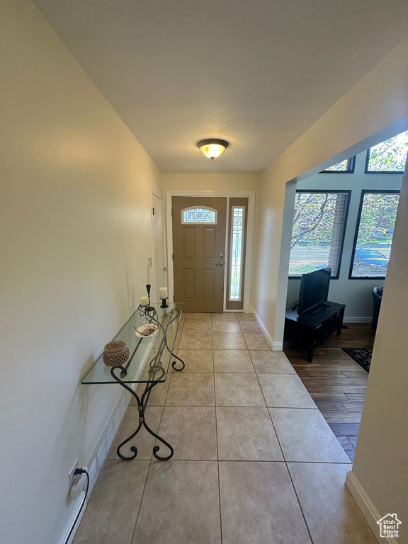 Tiled entrance foyer featuring baseboards