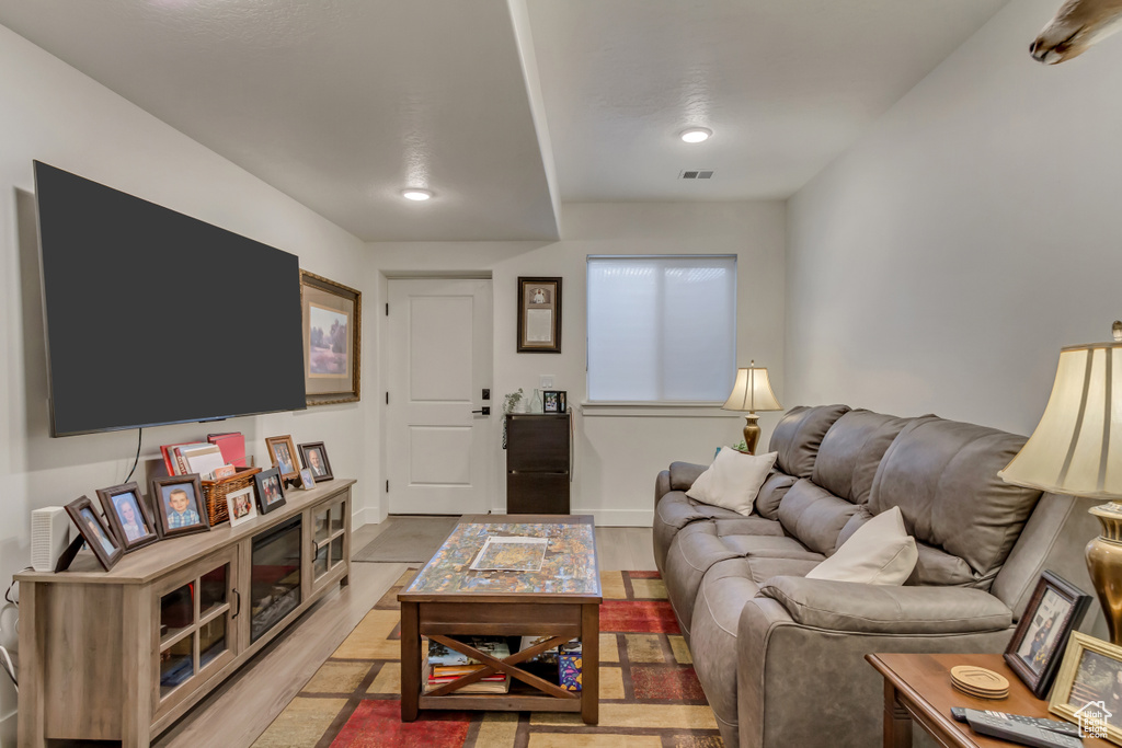 Living area with light wood-type flooring