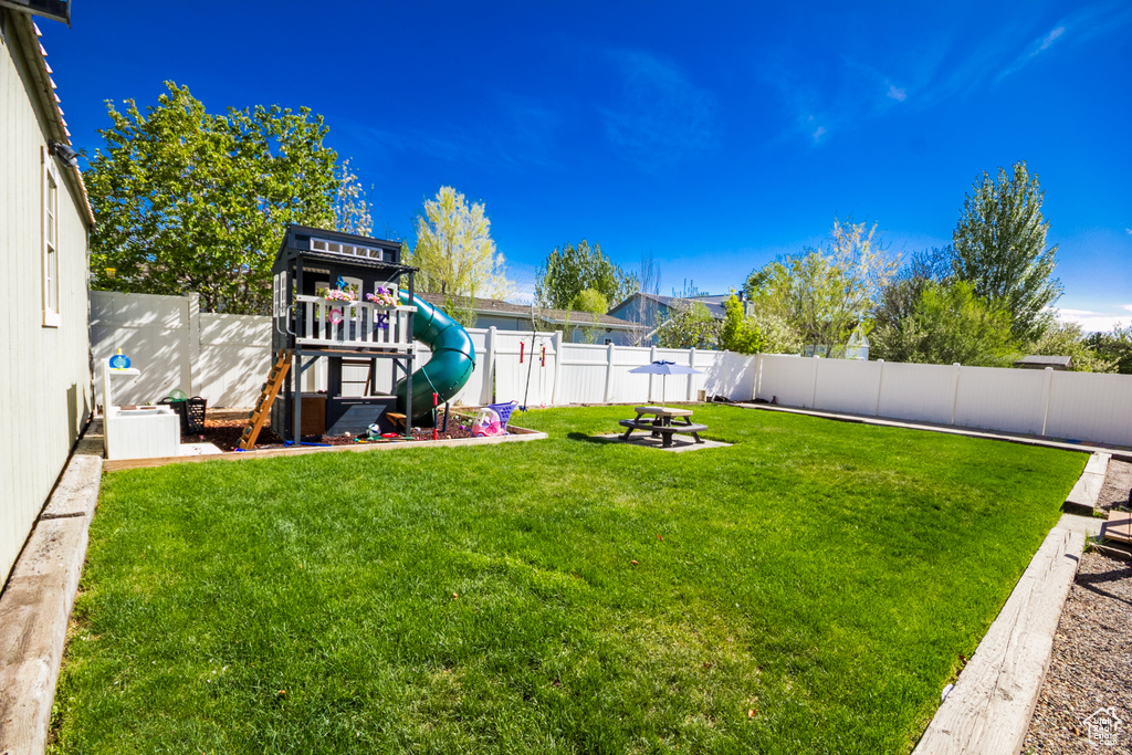 View of yard with a playground