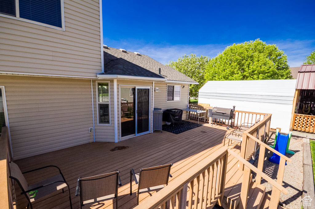 Wooden deck featuring outdoor dining space