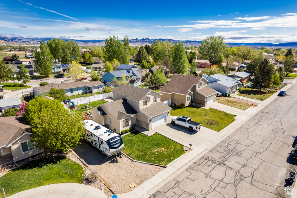 Aerial view of residential area featuring mountains