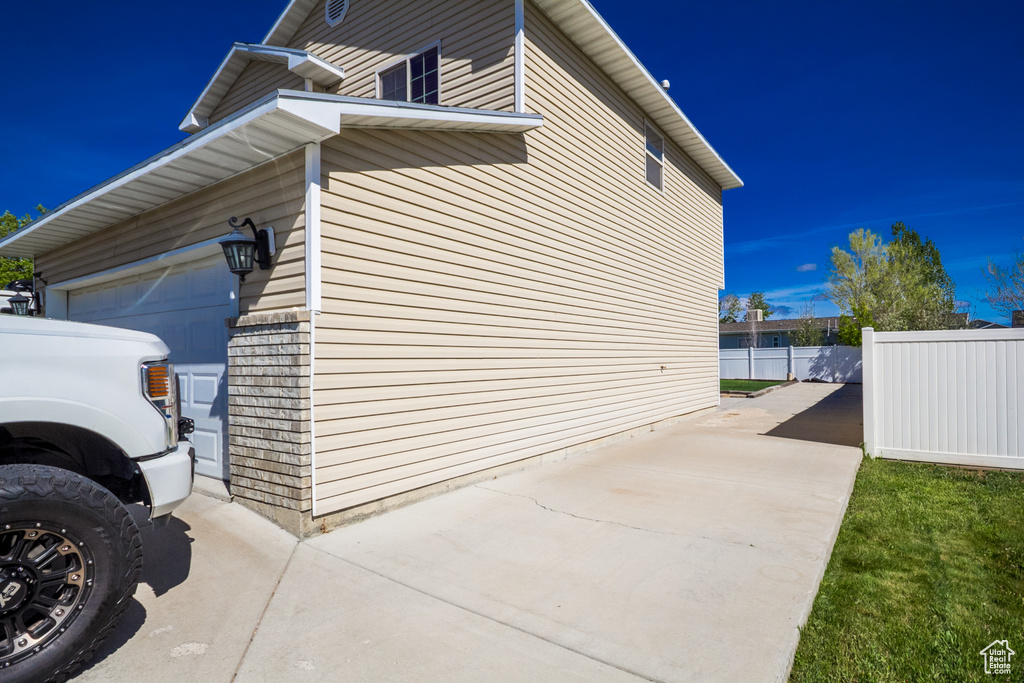 View of home\'s exterior featuring fence