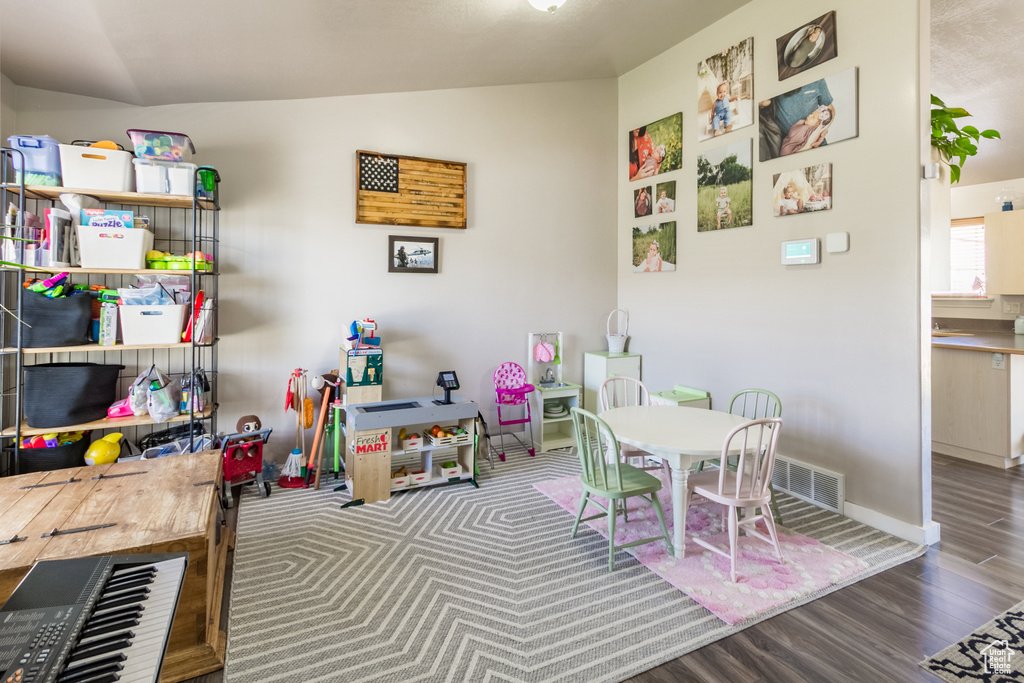 Rec room featuring wood finished floors and baseboards