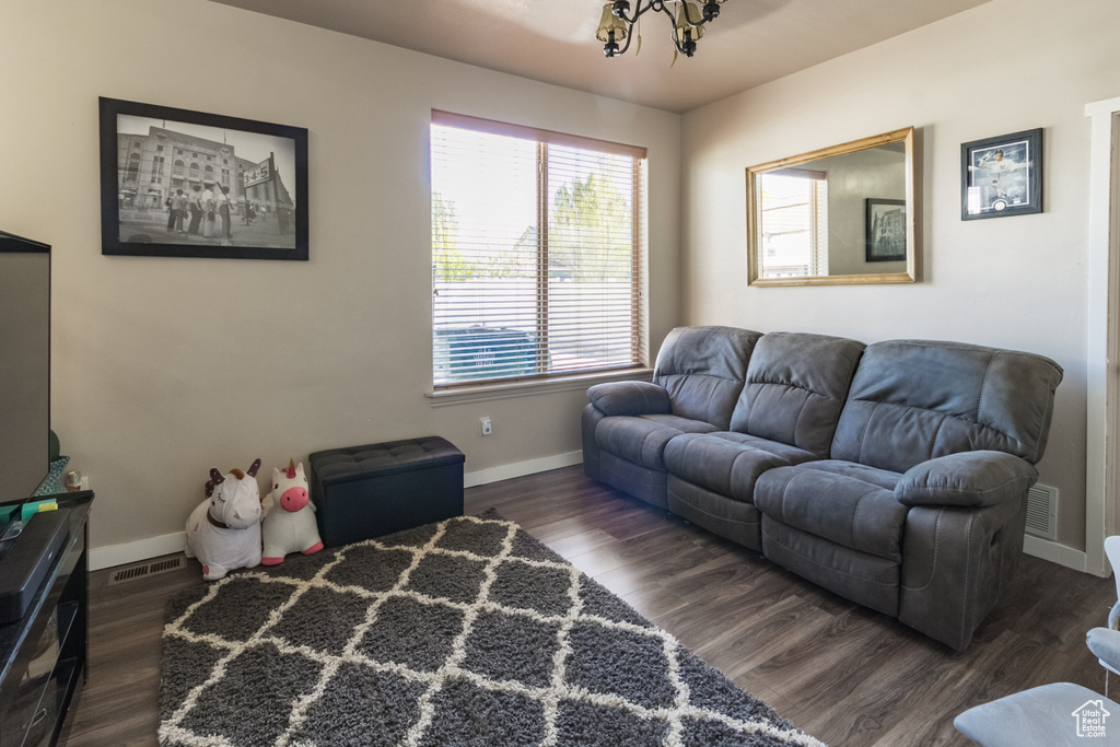 Living area featuring baseboards and wood finished floors