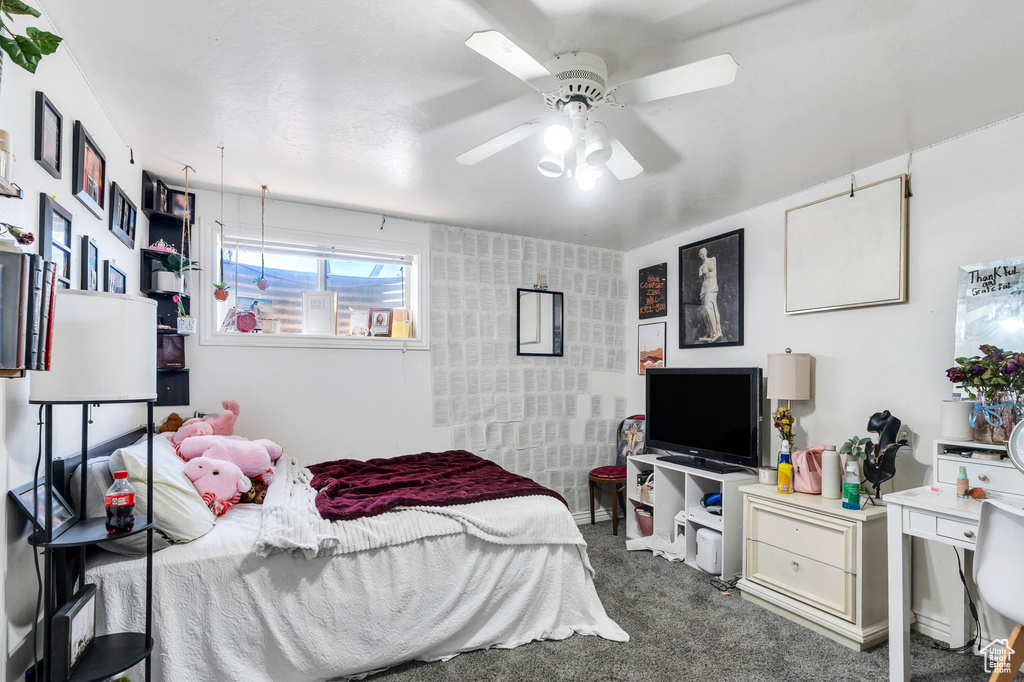 Bedroom featuring carpet flooring and a ceiling fan