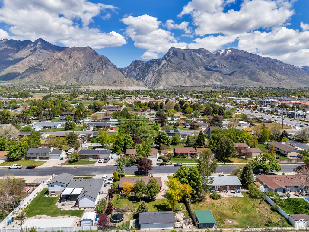 View of property location featuring nearby suburban area and mountains
