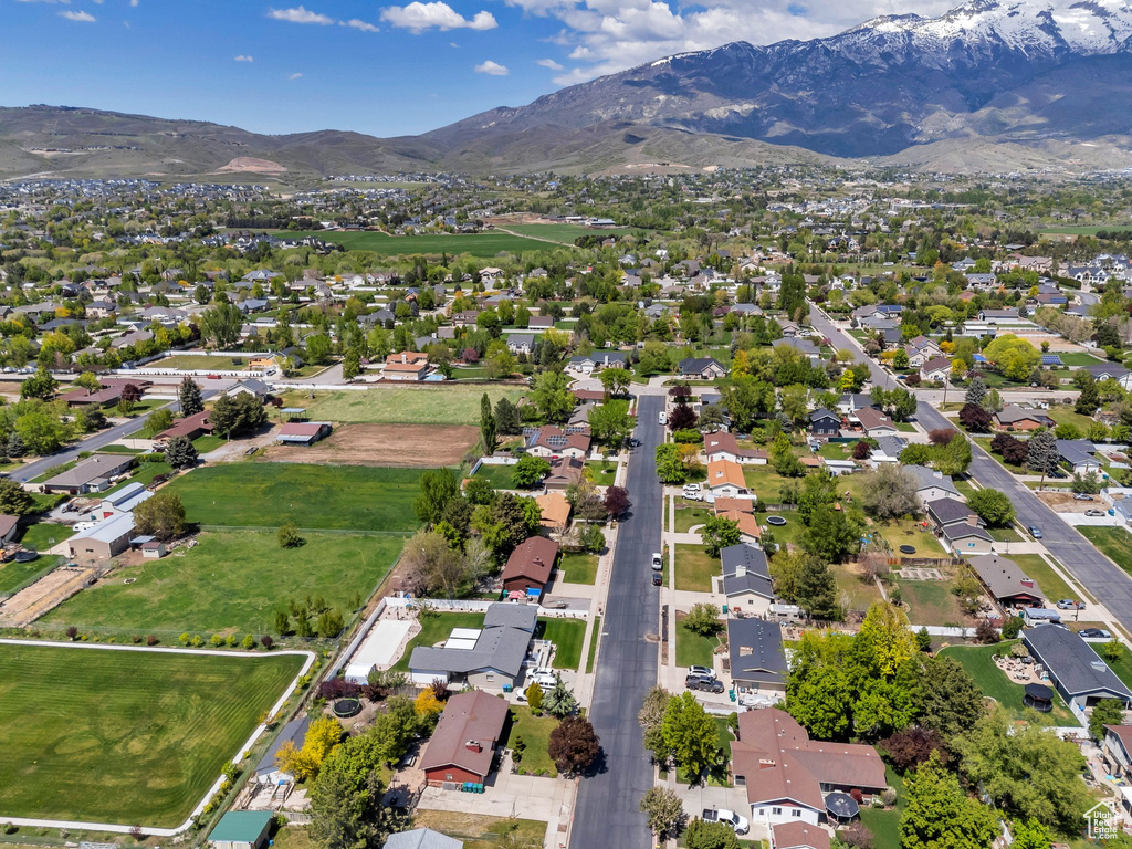 View of property location with a mountain backdrop and nearby suburban area