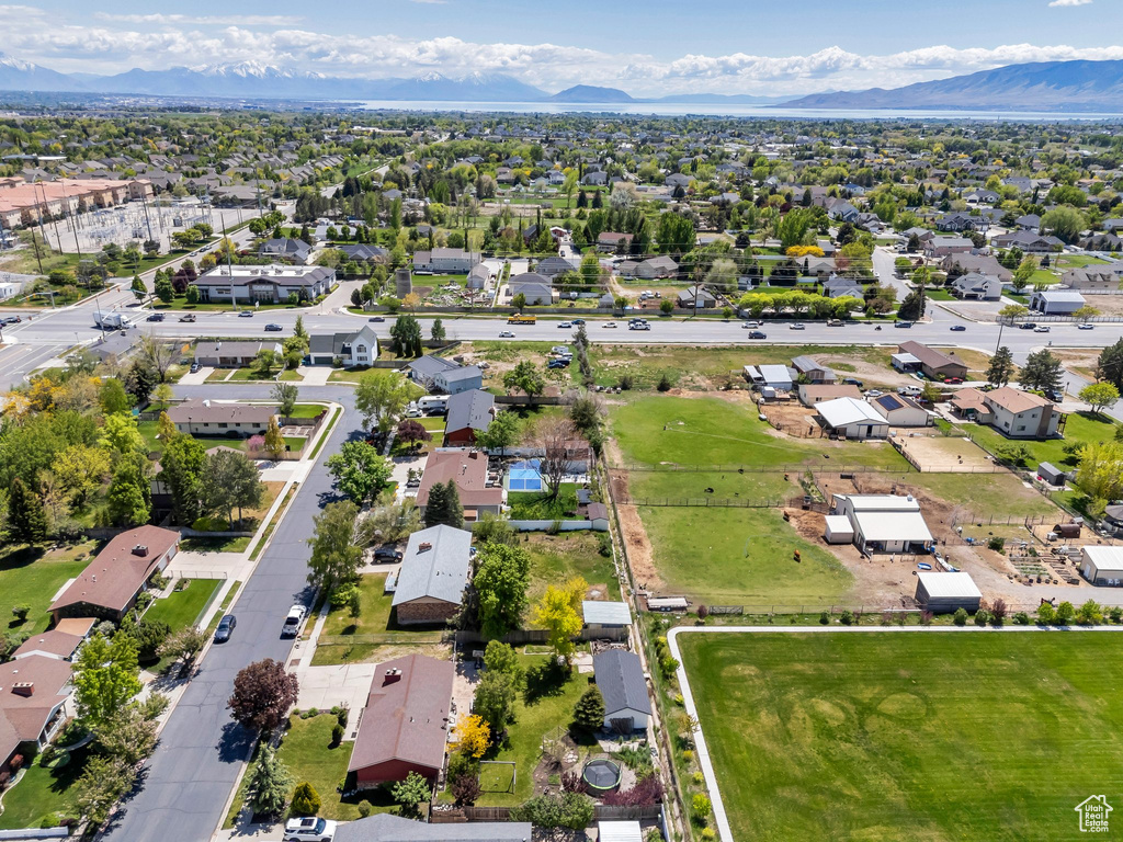 Aerial view of residential area featuring a mountain backdrop