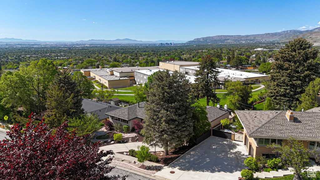 Aerial view of residential area featuring a mountain backdrop