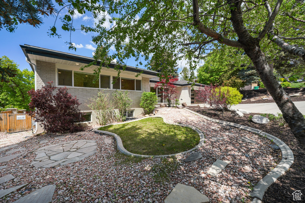 Back of property featuring brick siding