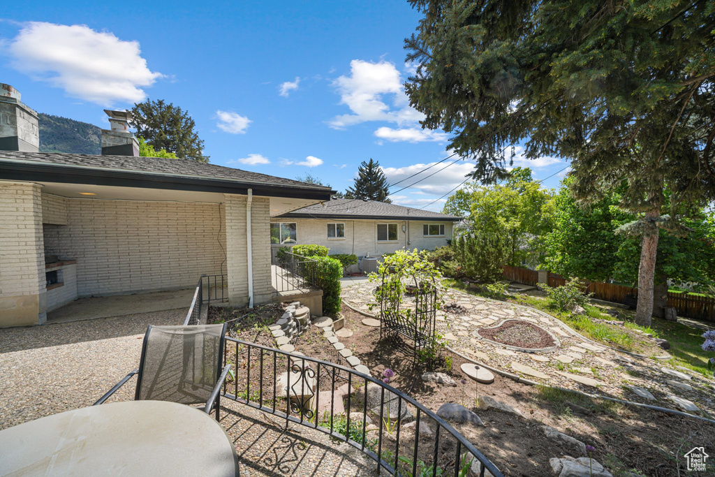 View of yard with a patio area and stairway