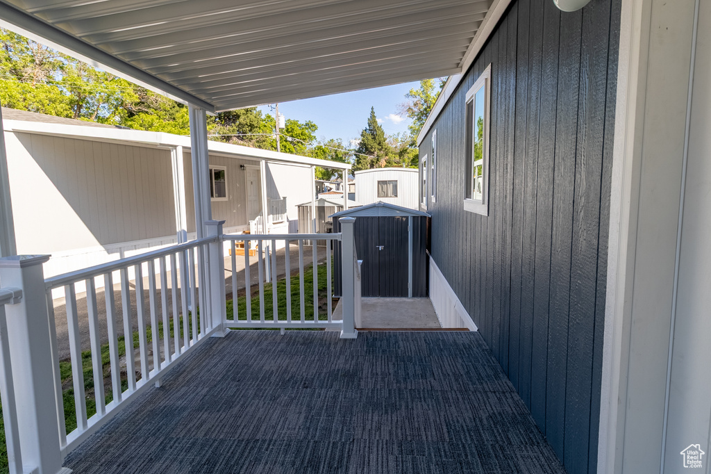 View of patio / terrace featuring a storage shed and an outdoor structure