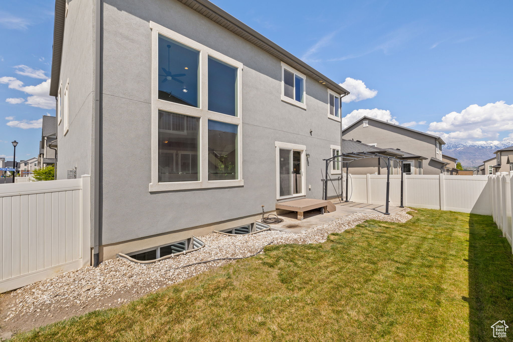 Back of house with stucco siding