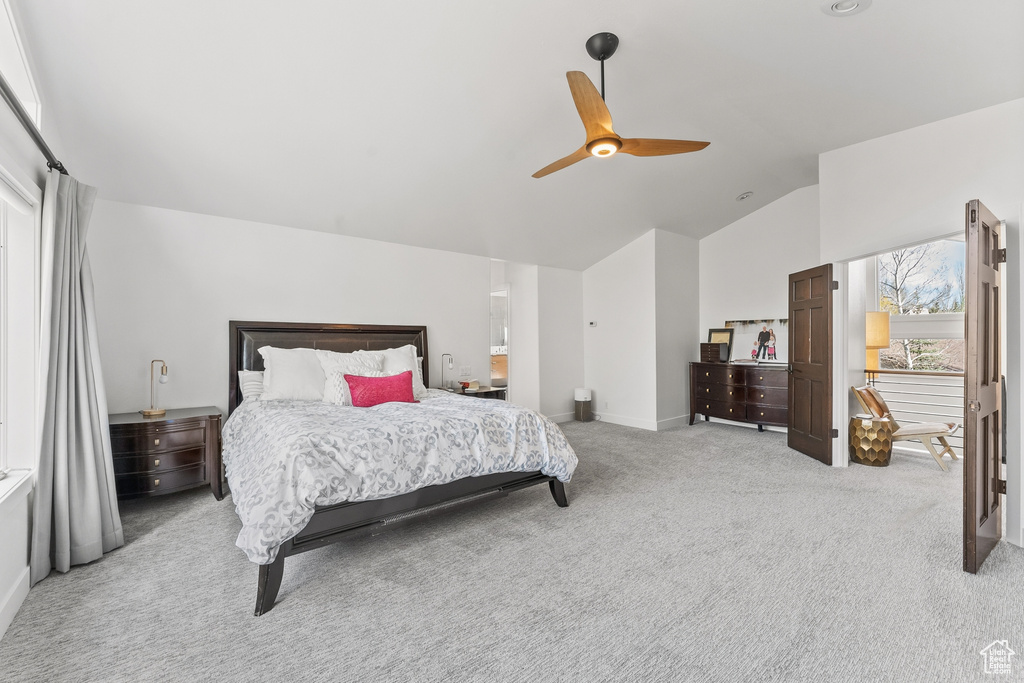 Bedroom featuring light carpet, vaulted ceiling, ceiling fan, and baseboards