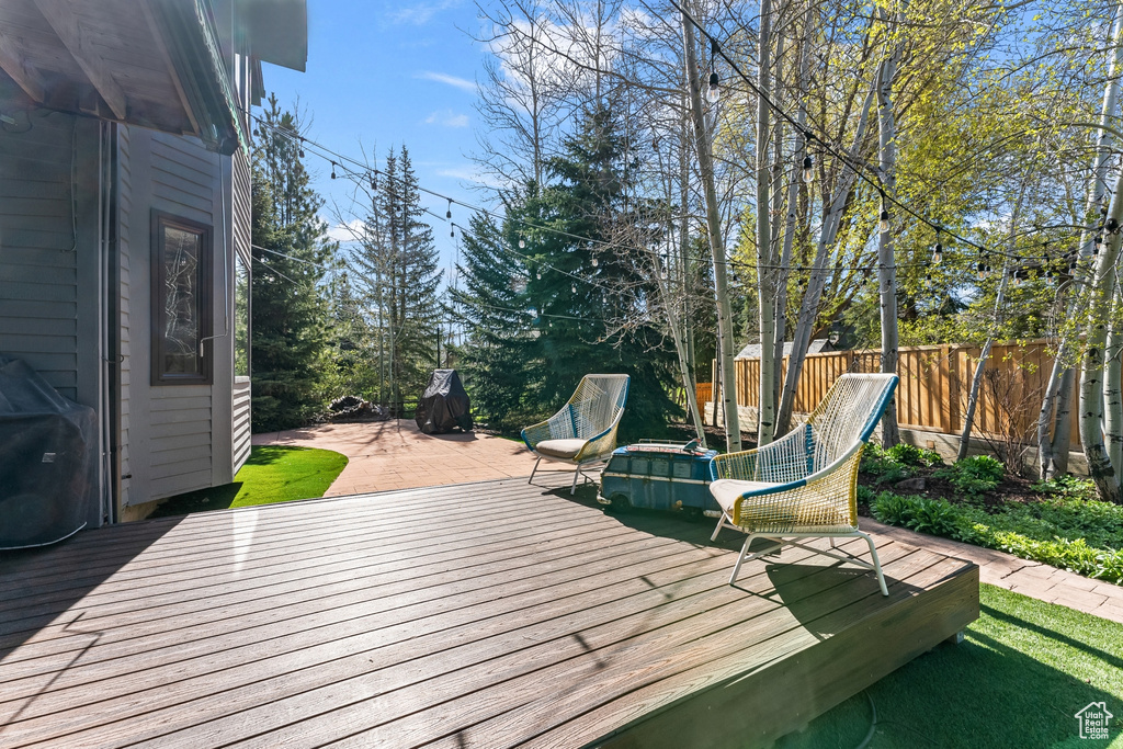 Wooden deck with fence and grilling area