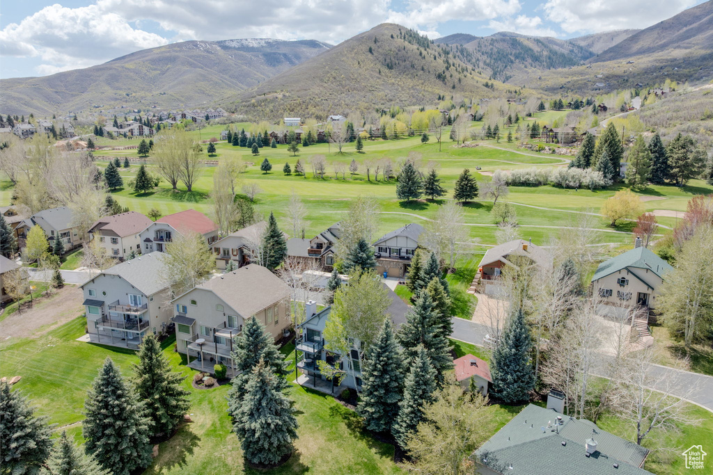 Aerial perspective of suburban area with a mountainous background