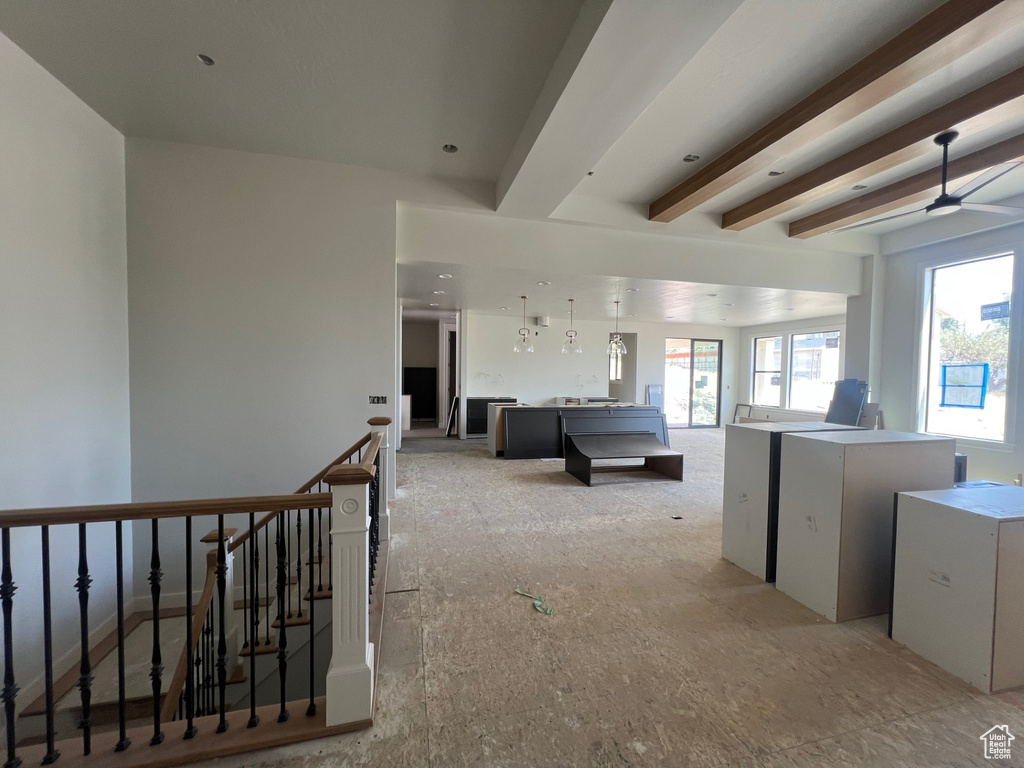 Hallway with an upstairs landing and beam ceiling