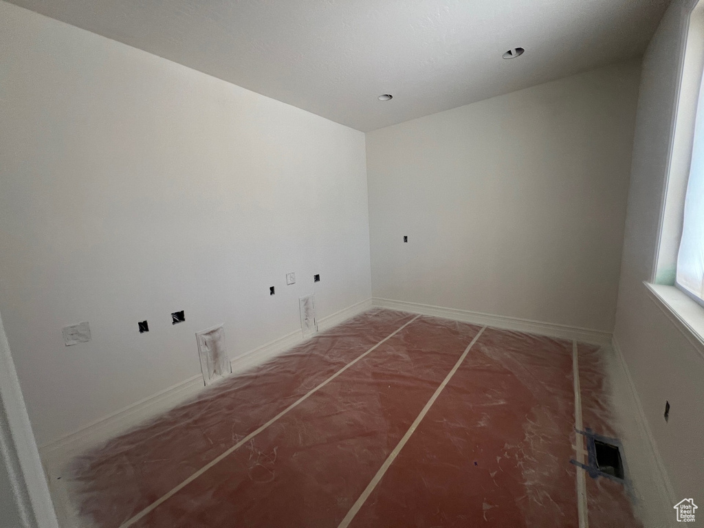 Laundry room featuring baseboards