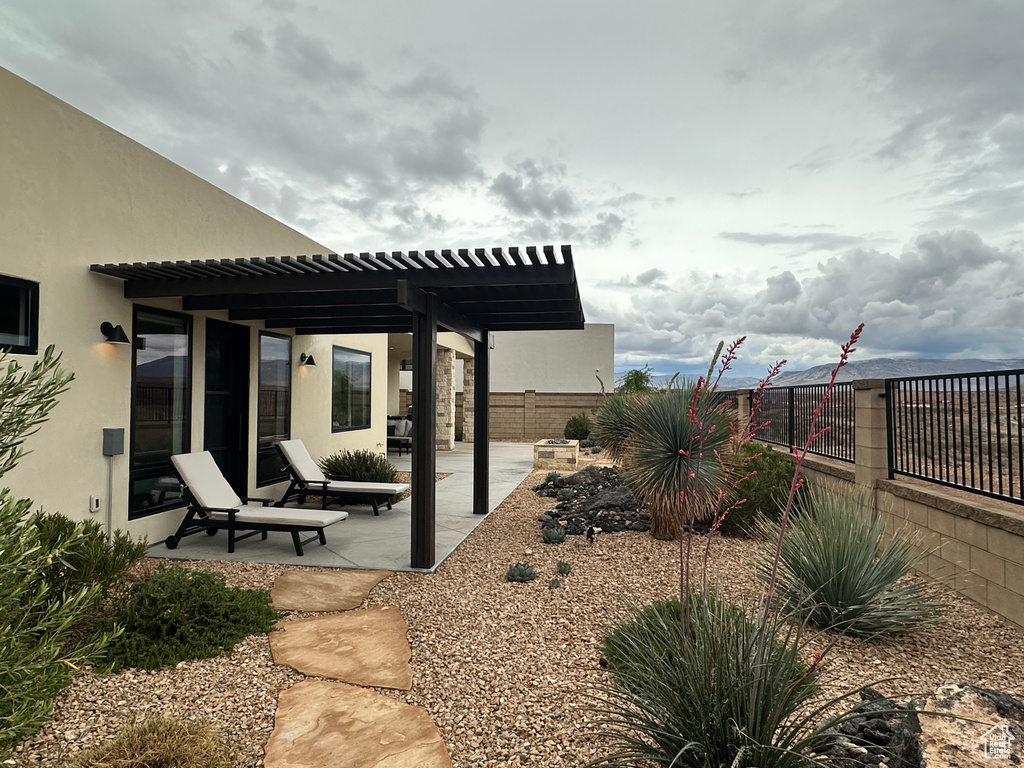 View of patio / terrace featuring a fenced backyard and a pergola