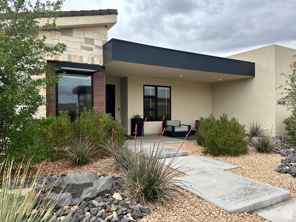 Rear view of property featuring stucco siding