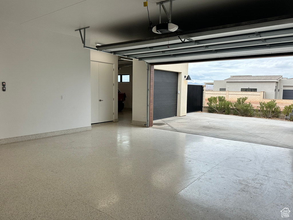 Garage featuring a garage door opener