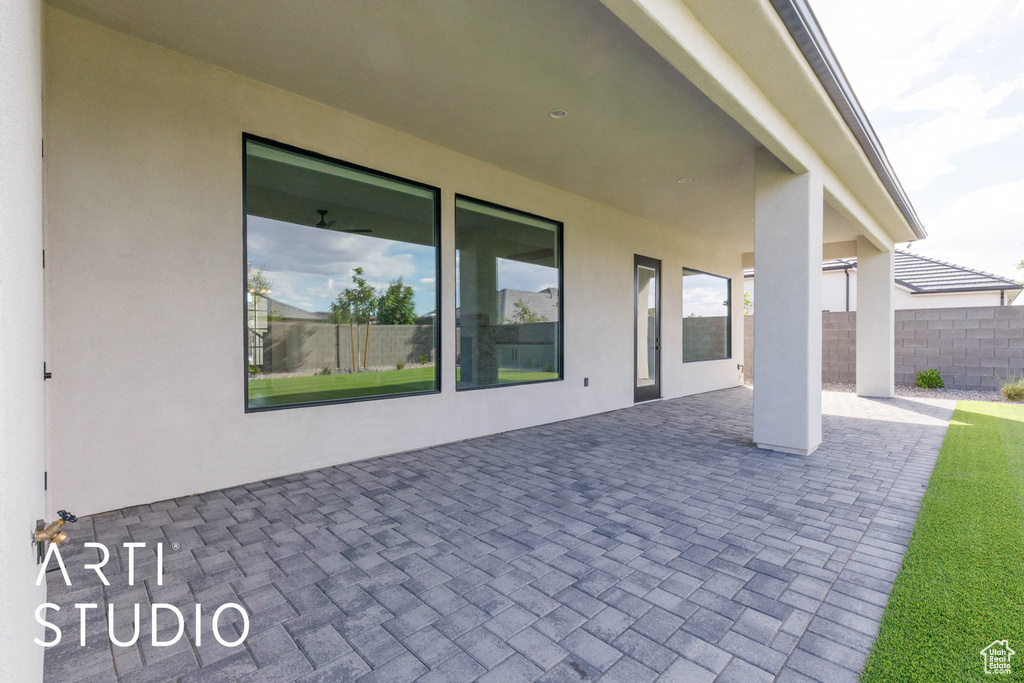 View of patio with fence