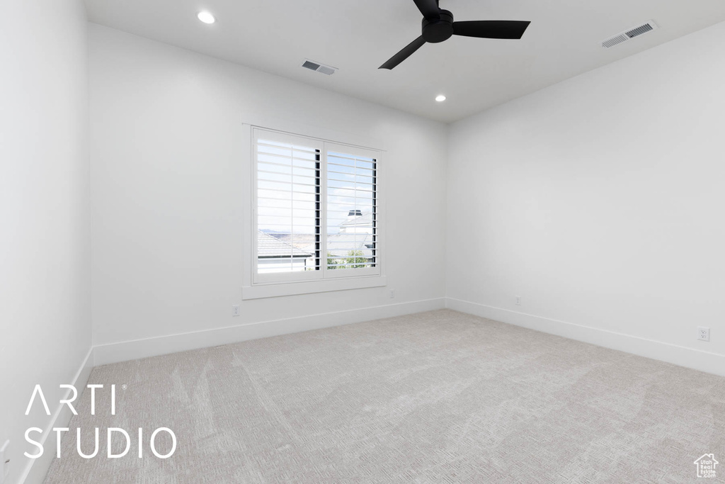 Spare room with carpet flooring, ceiling fan, baseboards, and recessed lighting