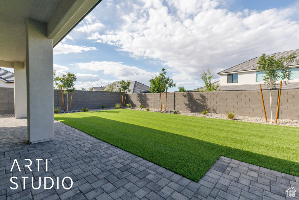 View of yard with a patio area