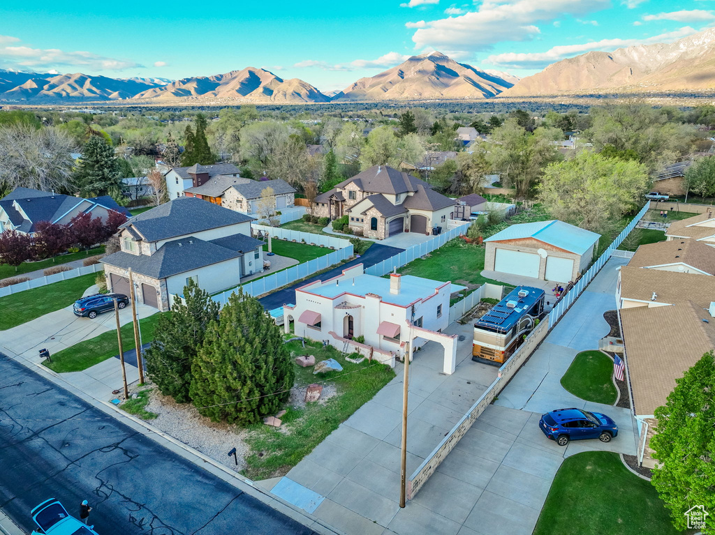 Aerial view of residential area featuring mountains