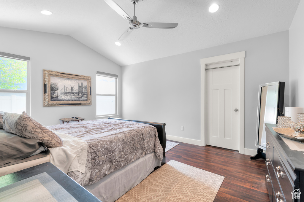 Bedroom featuring dark wood-type flooring, lofted ceiling, recessed lighting, baseboards, and a ceiling fan