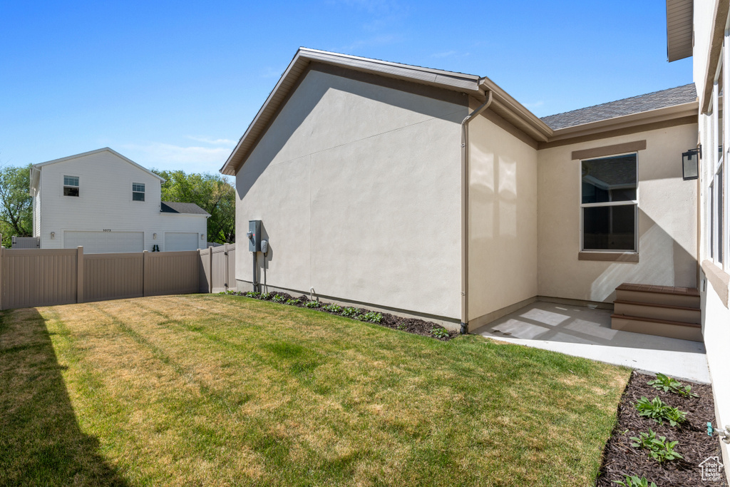 View of home\\\\\\\'s exterior with stucco siding and a patio