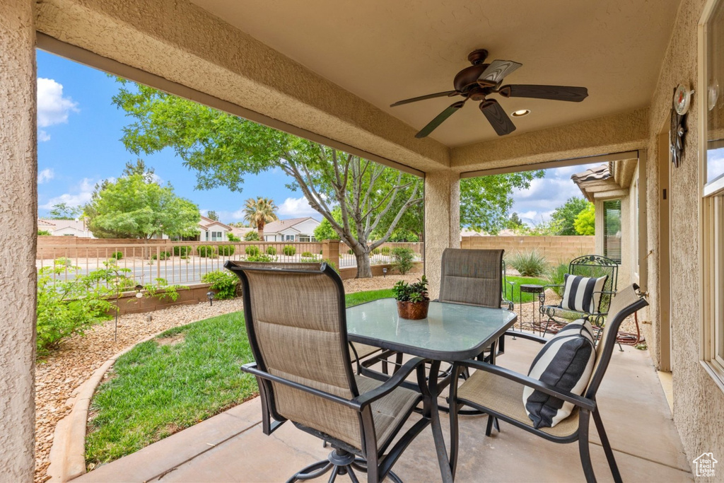 View of patio / terrace with ceiling fan, a fenced backyard, and outdoor dining area