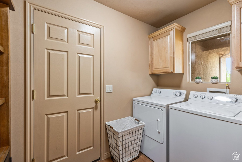 Washroom with cabinet space and separate washer and dryer