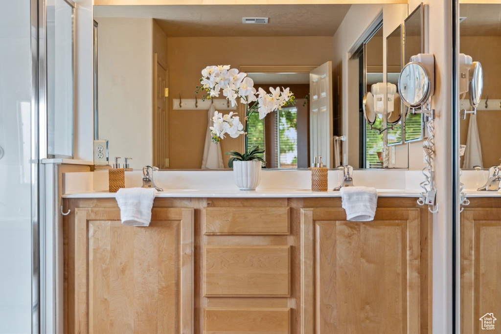 Full bath featuring vanity
