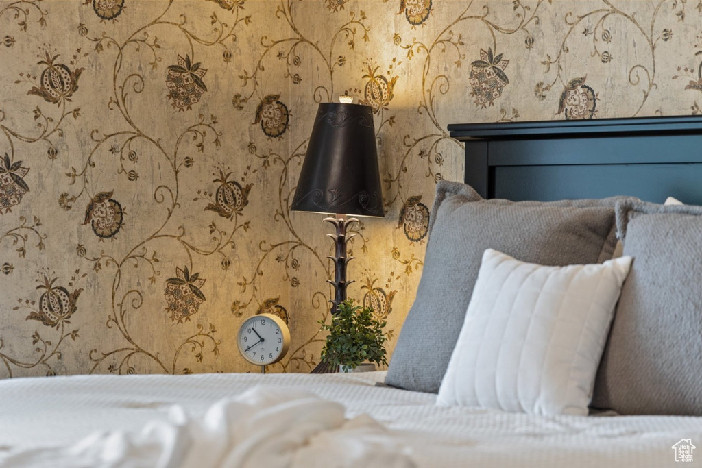 Bedroom view of wallpapered walls