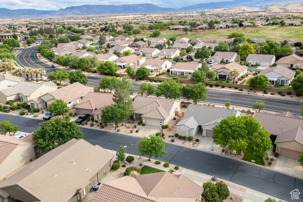 Aerial view of residential area featuring a mountain backdrop