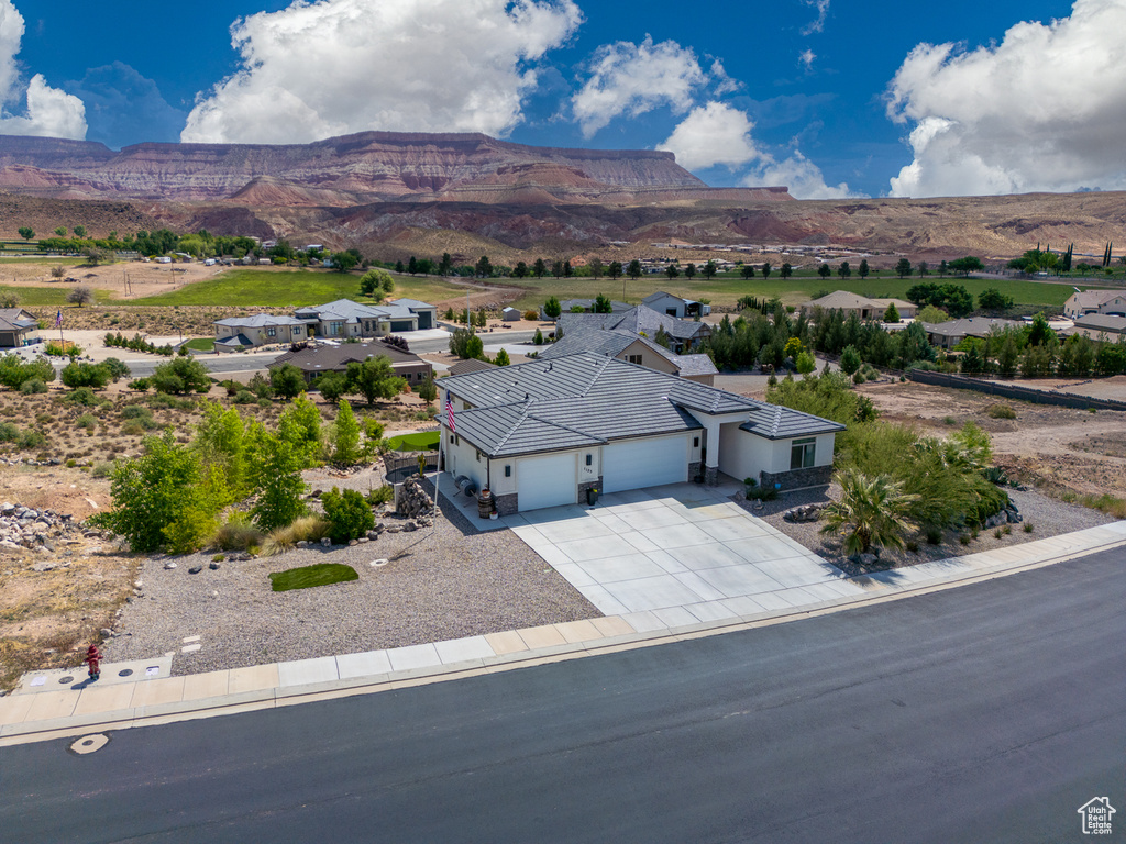 View from above of property featuring a mountainous background