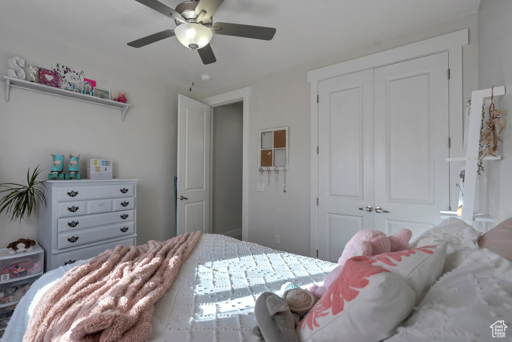 Bedroom featuring a closet and ceiling fan