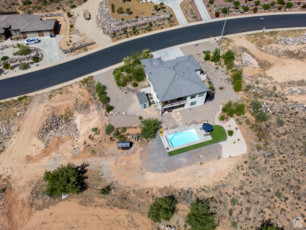 View of property location with a pool and a desert landscape