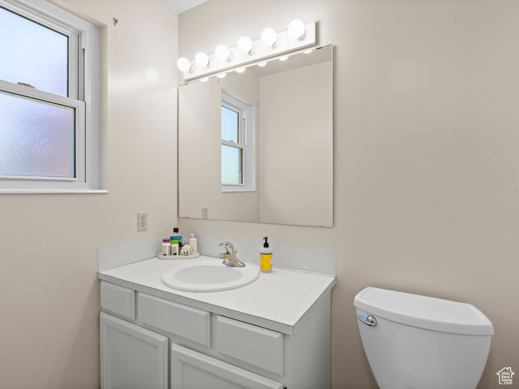 Bathroom featuring vanity and toilet