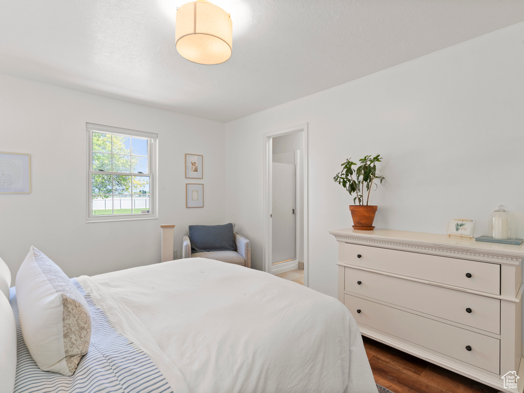 Bedroom featuring dark wood-type flooring
