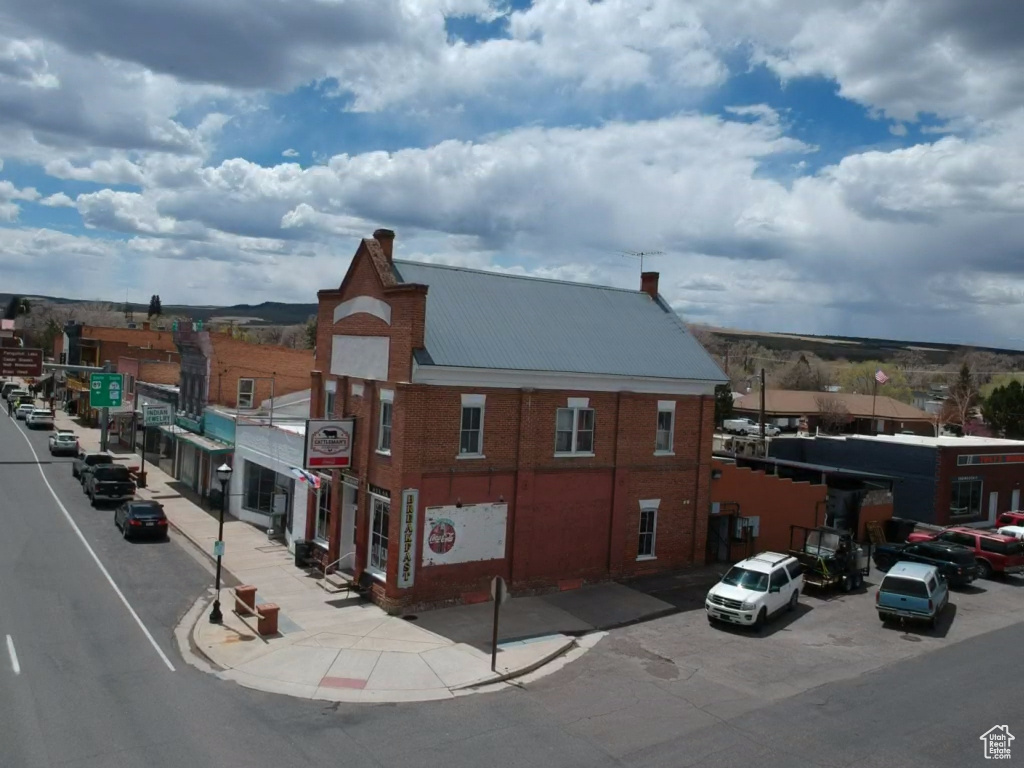 View of property featuring uncovered parking