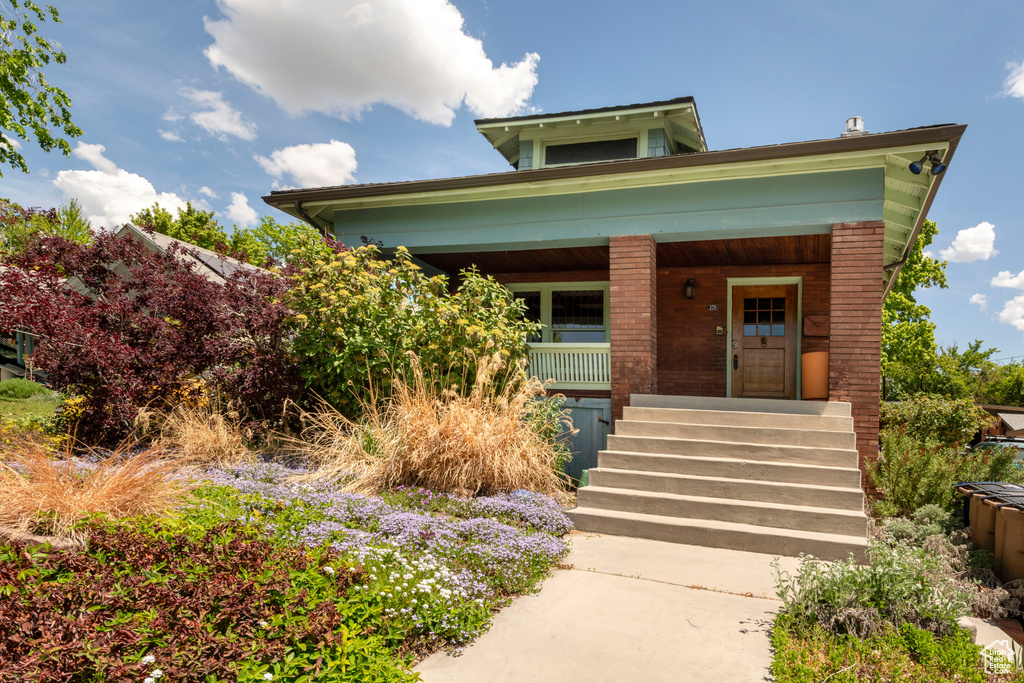 View of front of home featuring covered porch