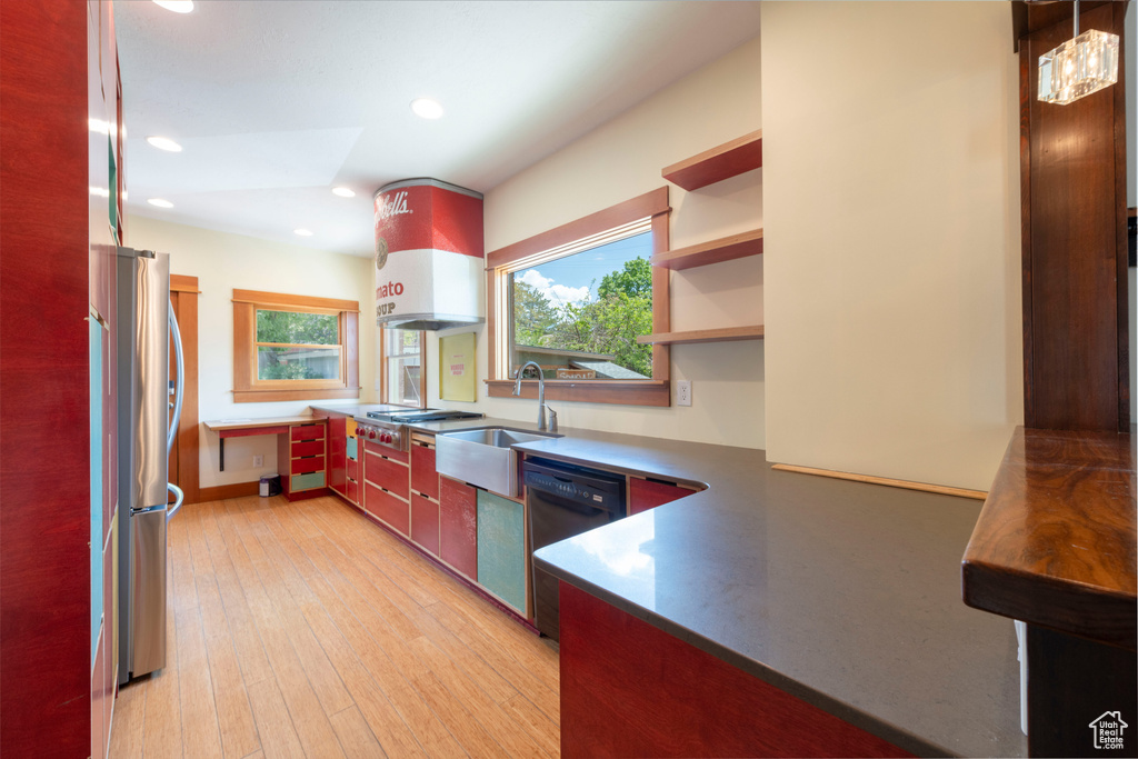 Kitchen with stainless steel appliances, a sink, open shelves, recessed lighting, and light wood-type flooring