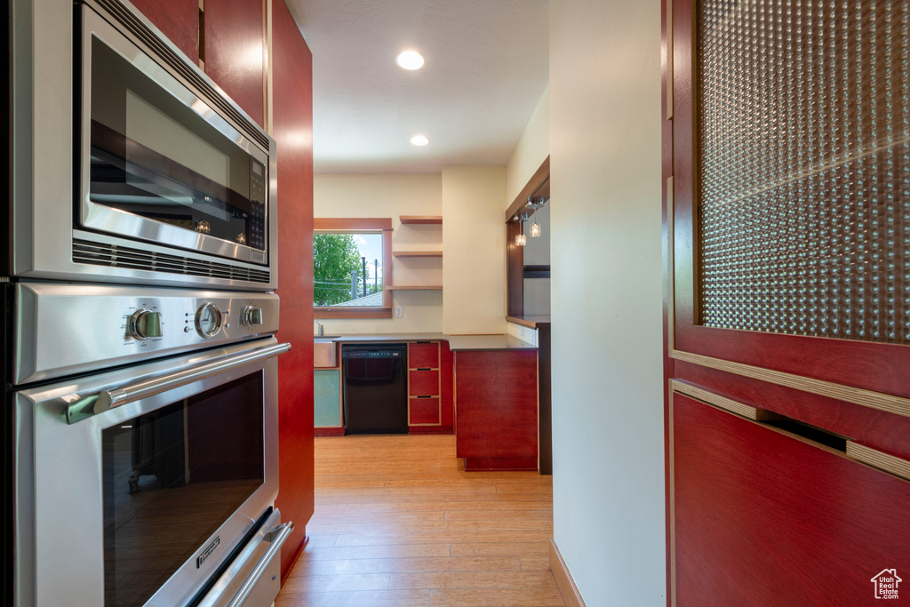 Kitchen featuring stainless steel appliances, light wood-style flooring, and recessed lighting
