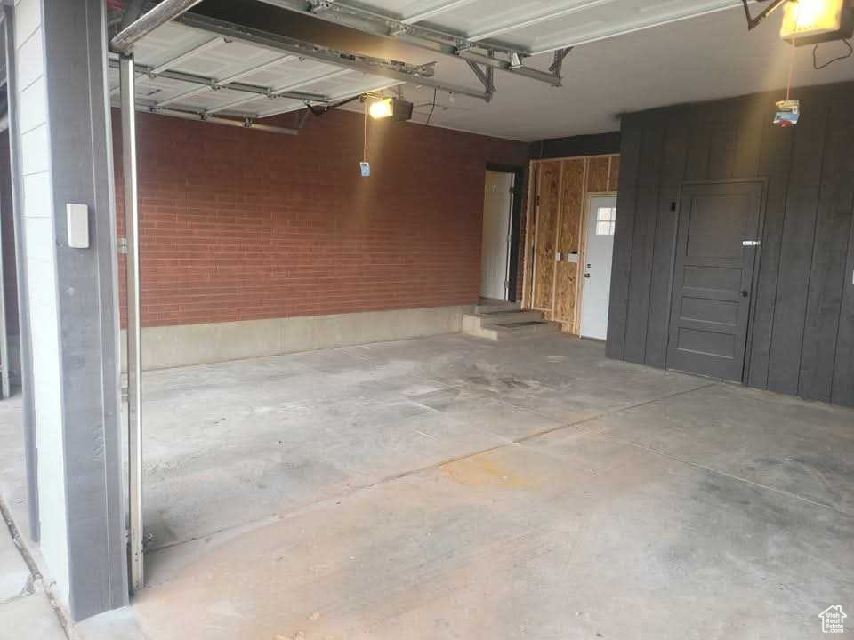 Garage featuring a garage door opener